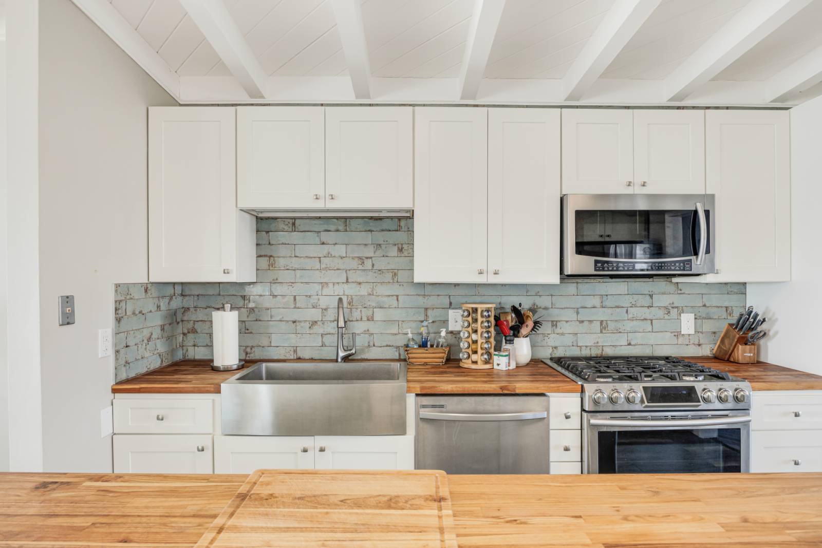 Updated kitchen with butcher block and gas range